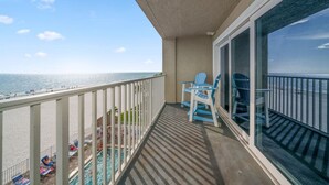 A balcony with a view of the beach and ocean. - Sea Oats Condo #302 Direct Gulf with Heated Pool (Redington Shores)