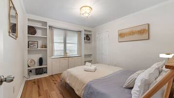 1 bedroom, desk, iron/ironing board, travel crib