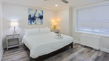 1 bedroom, desk, iron/ironing board, travel crib