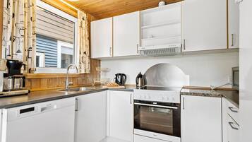 Fridge, stovetop, dishwasher, coffee/tea maker