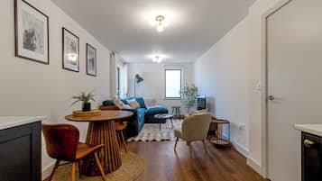 Apartment, City View | Living area | Flat-screen TV