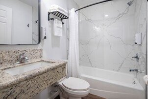 Standard Double Room, 2 Double Beds | Bathroom | Combined shower/tub, towels, soap, shampoo