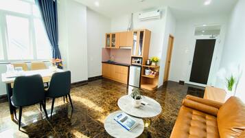 Business Apartment | Living area | 25-inch TV with premium TV channels, offices