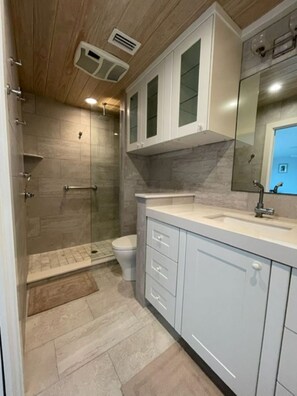 Shower, hair dryer, towels, toilet paper