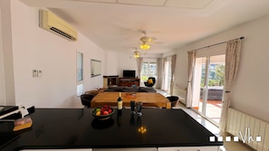 Enjoy meals in the central dining area with a view of the outdoors.