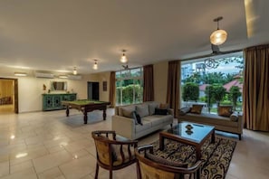 Superior Villa | Living area | Flat-screen TV