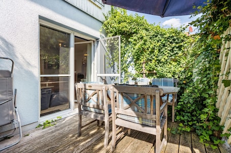 Outdoor dining. Holiday Home 'Ferienhaus Annika' with Private Terrace, Private Garden and Wi-Fi