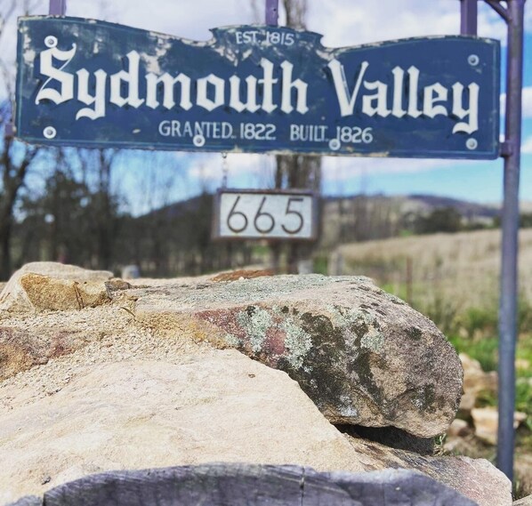 A road sign for 'Sydmouth Valley' with the number '665' below it. - Tiny House Tarana/ O’Connell. Close to Bathurst, Oberon. Peaceful surroundings. (Tarana)