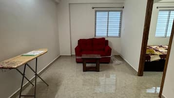Deluxe Double Room, City View | Living area | Flat-screen TV