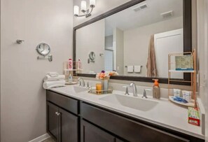 Shower, hair dryer, towels, soap