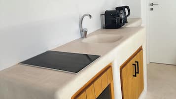 Fridge, coffee/tea maker, electric kettle, cookware/dishes/utensils