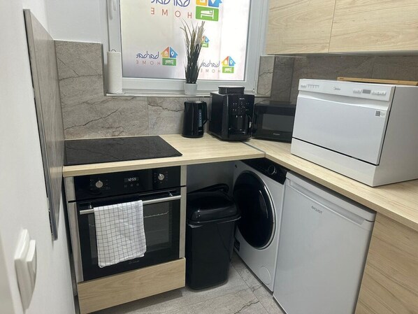 Enjoy cooking in this well-equipped kitchen with an oven, coffee maker, microwave, and dishwasher.