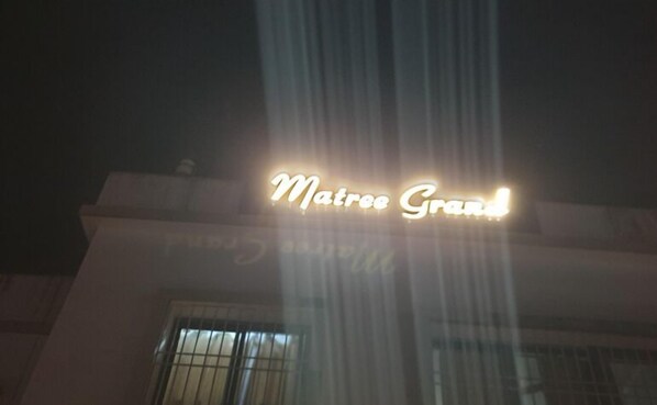 A building with a sign that reads "Matree Grand."