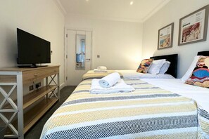 2 dormitorios, tabla de planchar con plancha, wifi y ropa de cama