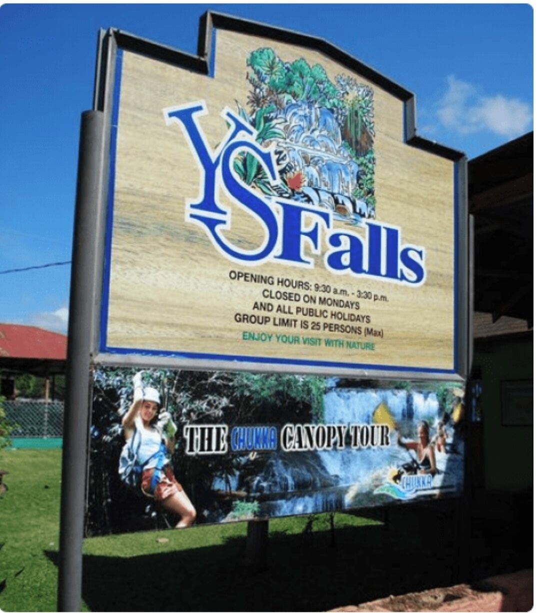 A sign for 'YSFALLS' with opening hours, closure information, and a group limit.