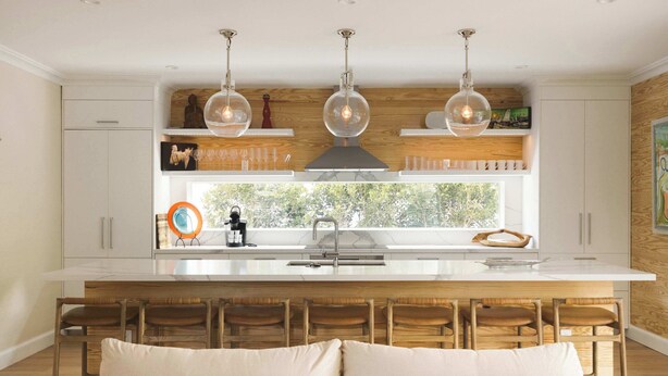 A modern kitchen with a central island, wooden chairs, and pendant lights. - The Rigby House - Pool, One block from Duval St (Key West)