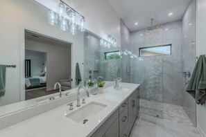 Shower, hair dryer, towels, toilet paper