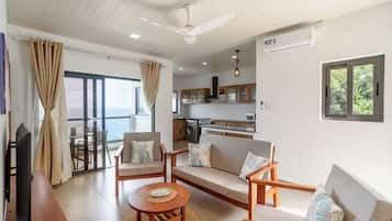 Family Apartment, 2 Bedrooms, Kitchen, Ocean View | Living area | Flat-screen TV
