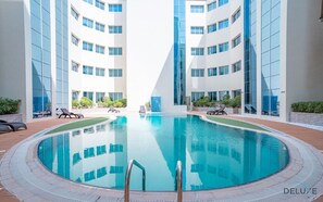 Pool - Charming Studio in Hanover Square, Jumeirah Village Circle by Deluxe Holiday Homes (Dubai)
