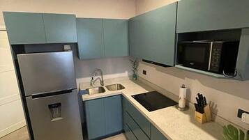 Fridge, microwave, stovetop, coffee/tea maker