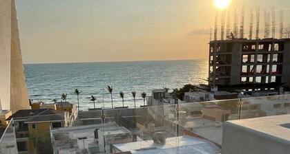 "Coastal Comfort: Stylish Apartment Just One Block from the Beach!"
