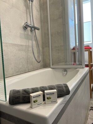 Hair dryer, towels, soap, shampoo