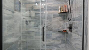 Shower, hair dryer, towels, soap