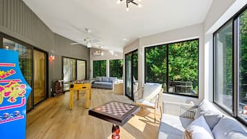 Smart TV, fireplace, foosball, books