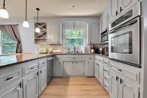 Cookware/dishes/utensils - Spacious 6 bedroom house in GVL with Game Room, 2 Living Rooms, 3 King Beds (Greenville)