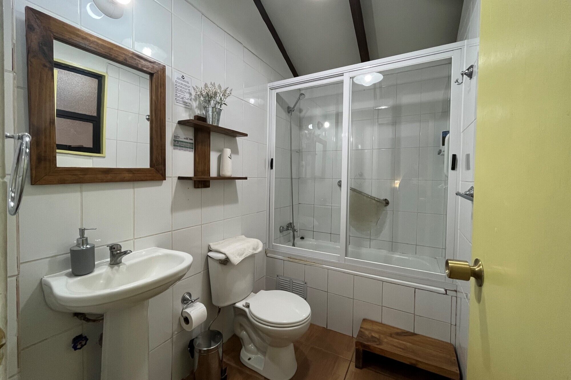 A bathroom with a sink, toilet, and shower.