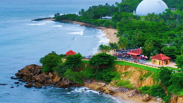 A coastal area with a beach, a large dome structure, and a small pavilion. - New Boutique House with Pool near the Beach (Rincón)