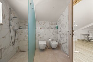 Shower, hair dryer, towels, toilet paper