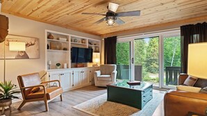 TV, fireplace, books - A Frame - Walk to Beach - Hot Tub (Ellsworth)