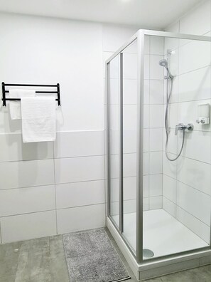 Shower, hair dryer, towels, soap