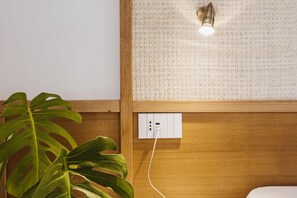 A wooden wall with a power outlet and a light fixture. - Exclusive Suite with Terrace by Sorrento main Square (Sorrento)