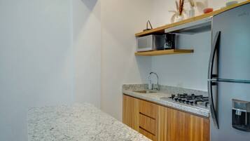 Fridge, microwave, stovetop, coffee/tea maker