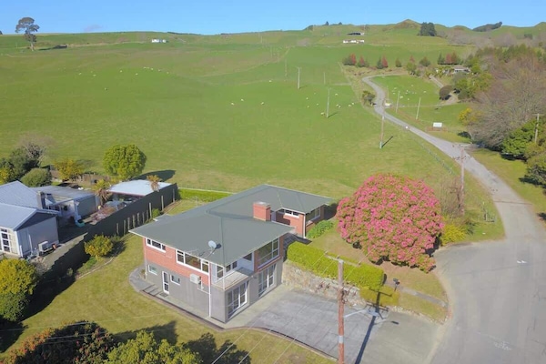 Aerial View Over Hilltop Home