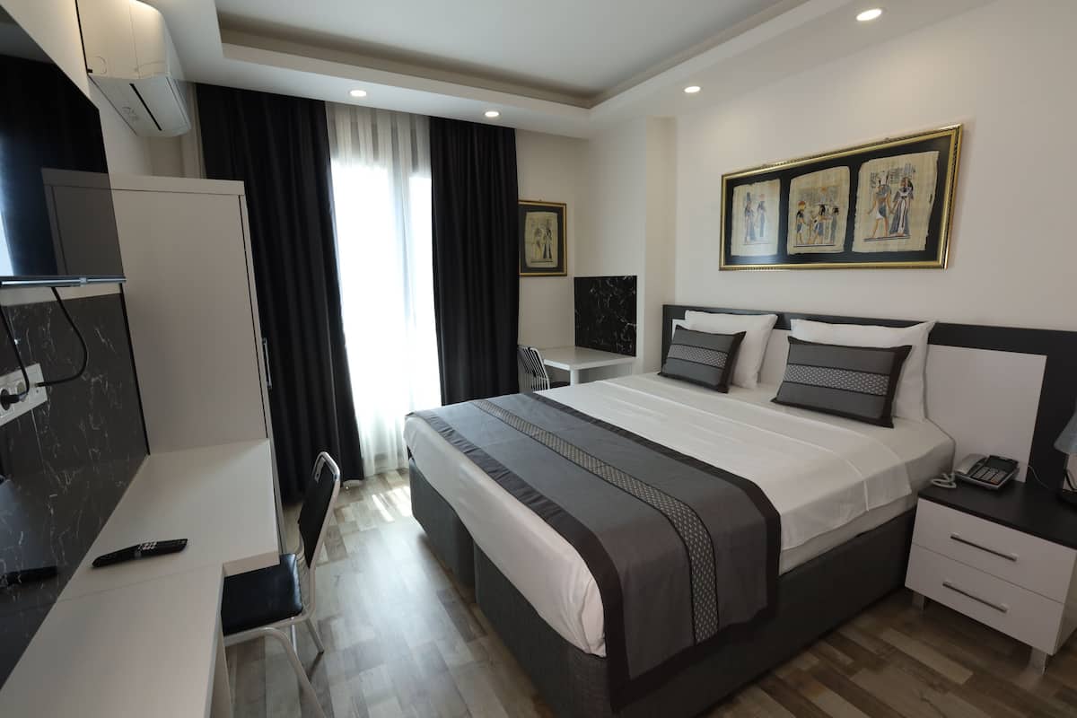 Premium bedding, desk, laptop workspace, free WiFi