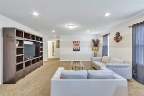 TV, foosball - Family-Friendly Villa w Pool, Hot Tub & Game Room (Kissimmee)