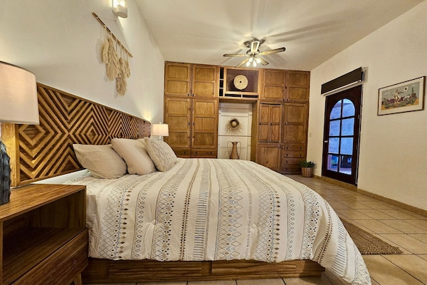 Your king-sized bed with luxury bedding awaits