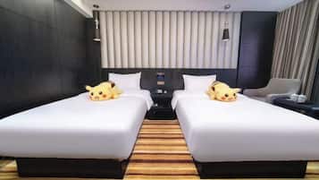A hotel room with two beds, a large window, a flat-screen TV, and a minibar.