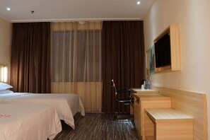 A hotel room with two beds, a desk with a chair, a TV, and a large window with curtains. - Urban Convenient Hotel (Guangdong University of Petrochemical Technology Branch) (Maoming)