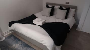 1 bedroom, desk, iron/ironing board, travel crib