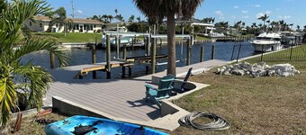 Waterfront Relaxation: Gulf access home with heated pool & spa, dock, and kayak
