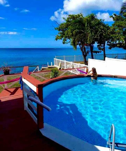 Ocean front 2-bedroom house private Beach, pool in enchanting Rincon wifi AC