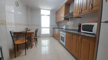 Apartment | Private kitchen | Fridge, microwave, oven, stovetop