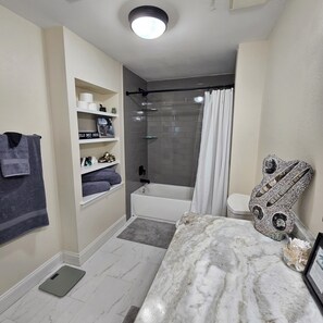 Hair dryer, towels, soap, toilet paper