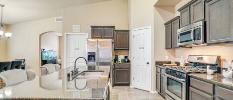 Coffee/tea maker, toaster, cookware/dishes/utensils, dining tables