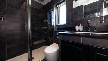 Shower, hair dryer, towels, soap
