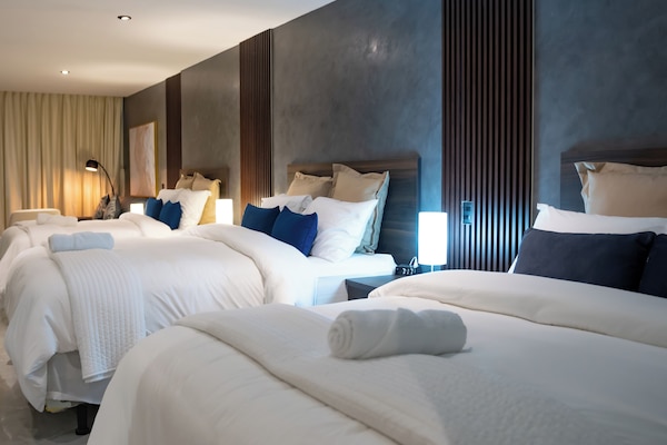 Luxury Suite, Pool View | 1 bedroom, desk, laptop workspace, free WiFi